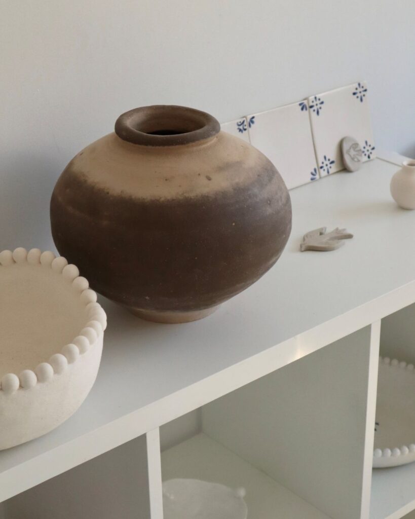 Eva Temple ceramics styled on minimal shelf