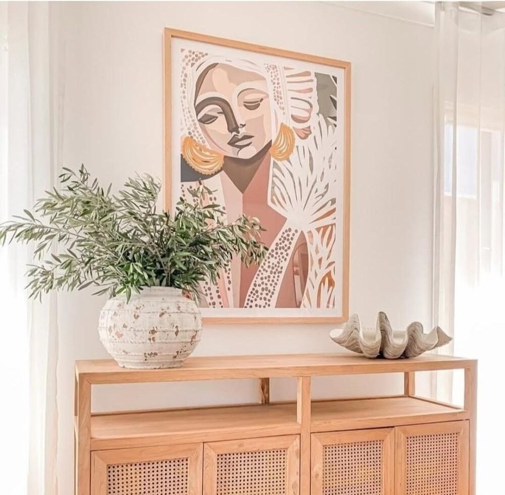 Face artwork by Haven Prints above sideboard