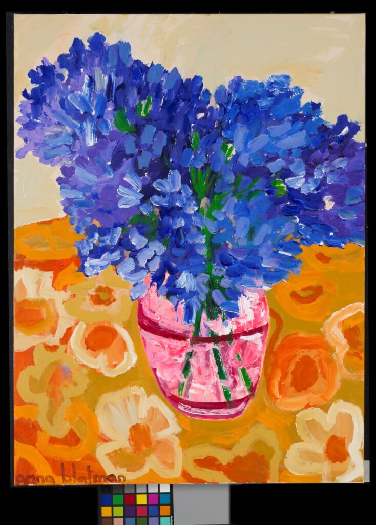 Vibrant blue florals in pink vase