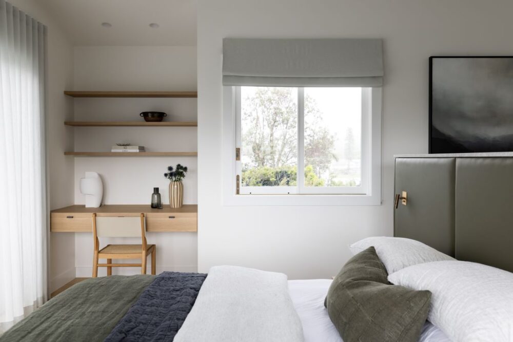 Serene bedroom with workspace and modern décor by Annie Bowen at North Avoca Beach House.