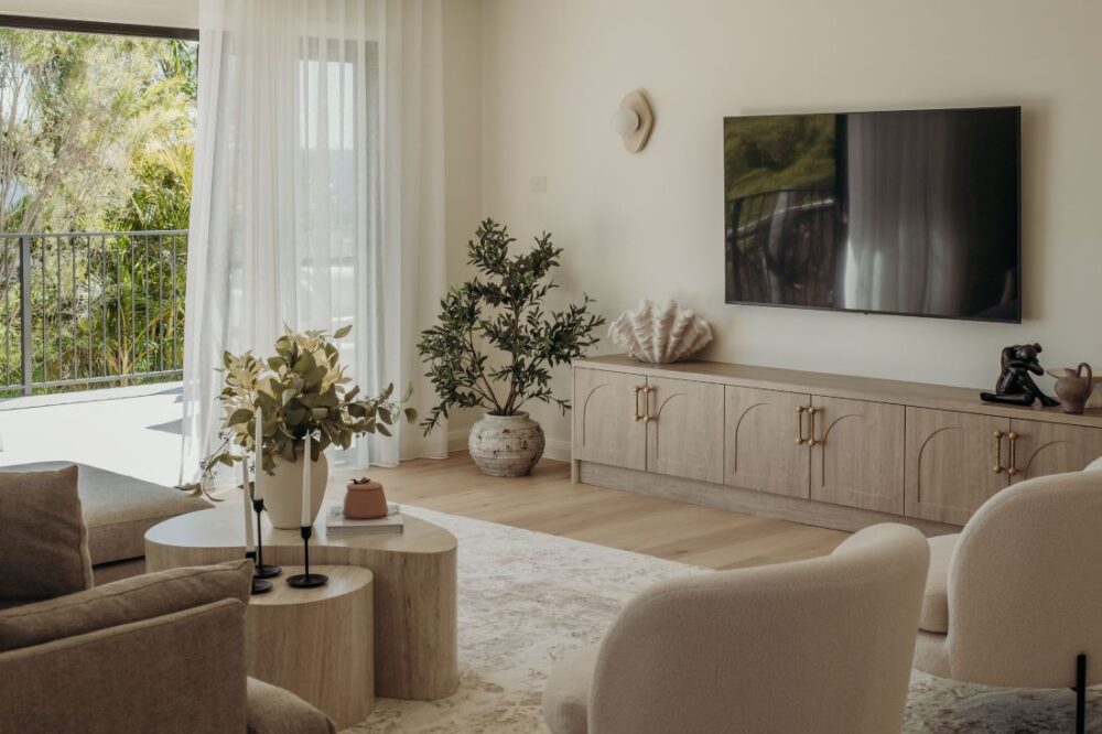 Modern living room with stylish furniture, TV unit, and natural light by Sabina Christine Interiors at 48 Bilwara Avenue.
