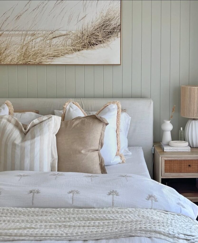 Pale green panelled feature wall in bedroom