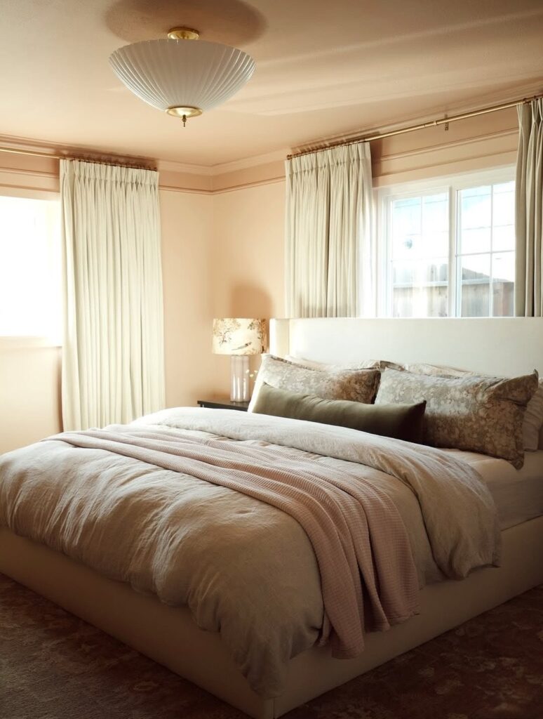 Pink bedroom with crown moulding feature