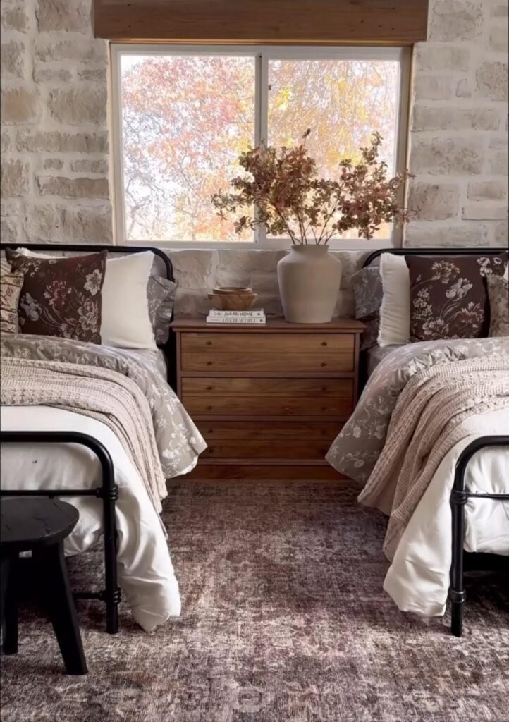 Stone feature wall in cosy twin bedroom