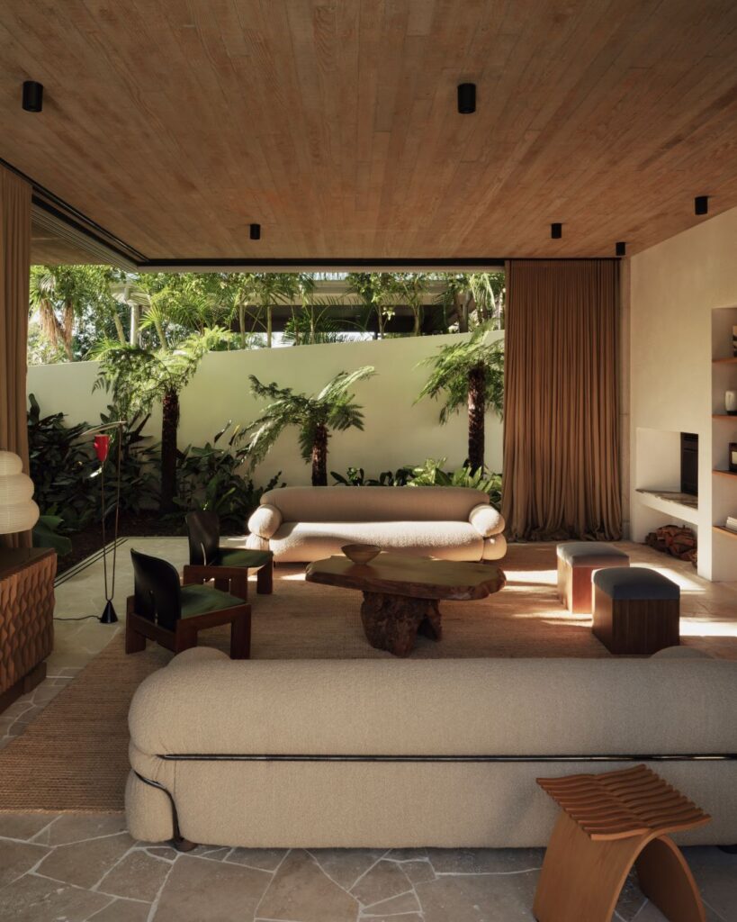 Modern indoor lounge with curved sofas and natural light