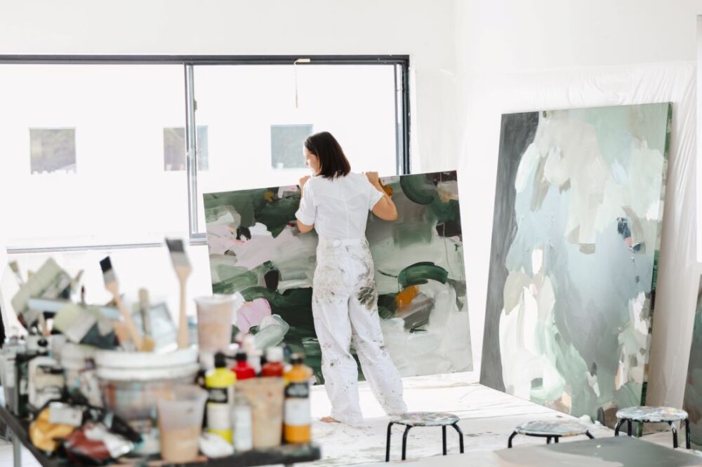 Alisha Falconer moving green abstract painting in studio