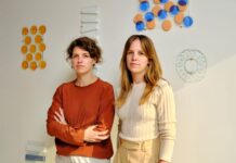 Sensory art you’ll want to touch: A+N Studio Alissa and Nienke, female designers, standing in a sunlit studio in front of colourful translucent material samples.