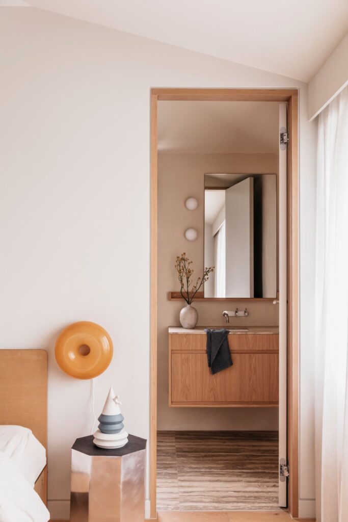 Neutral bedroom with vanity and decorative items