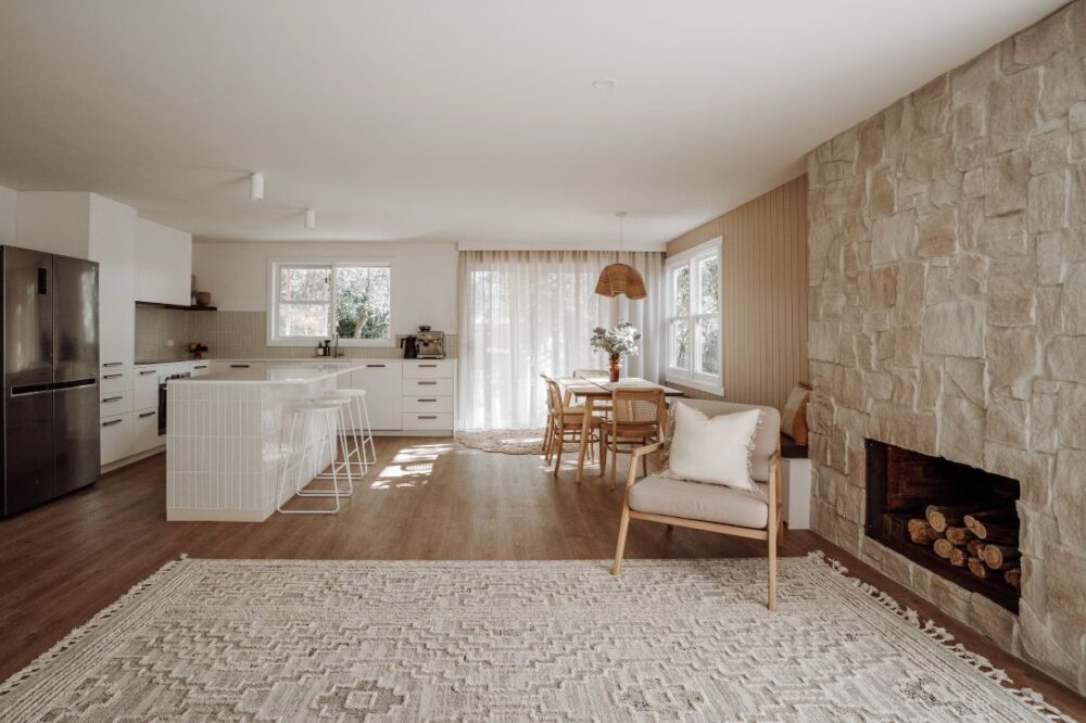 Open plan living space with stone fireplace