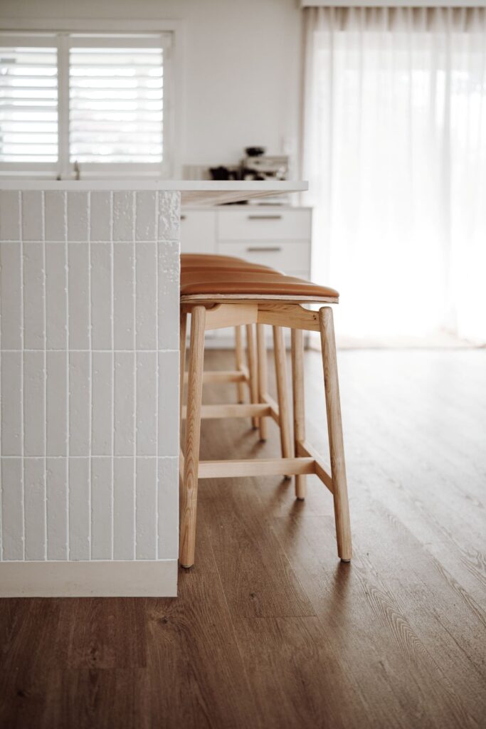 Detail view of leather stool and tiling