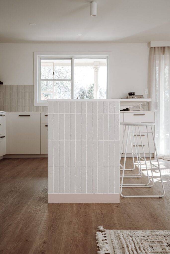 Profile view of modern tiled kitchen island