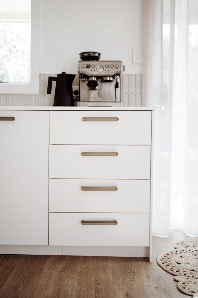White kitchen drawers with coffee machine