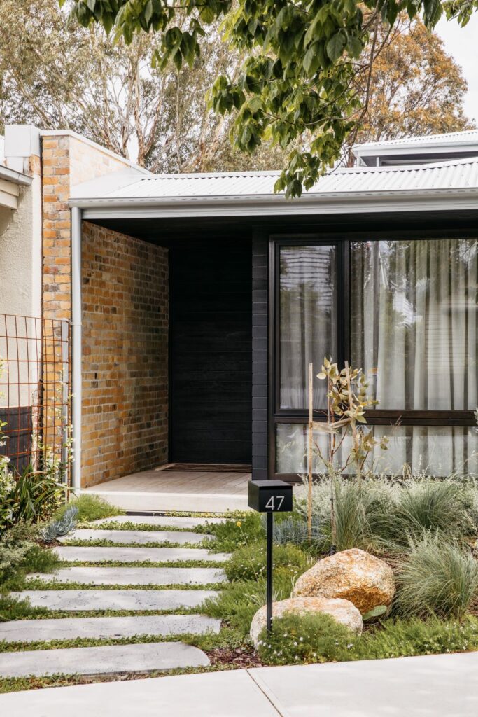 Front of modern home with black cladding