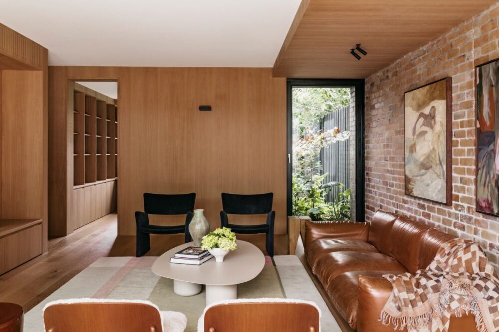 Contemporary lounge with brown leather sofa