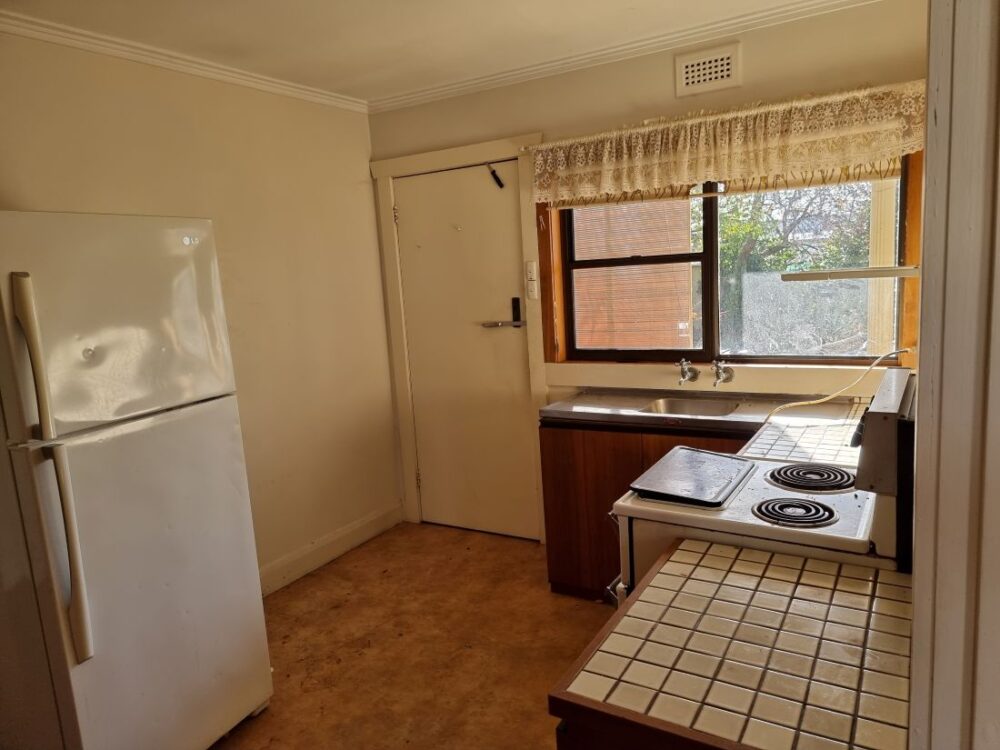 Dated kitchen interior before house renovation