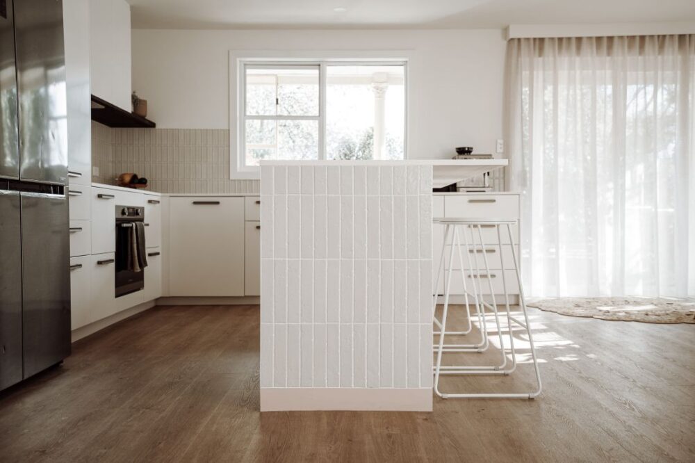 Profile view of modern tiled kitchen island