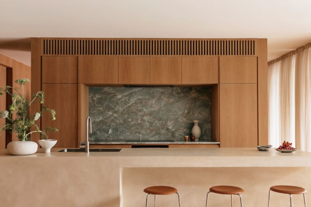 Modern kitchen with stone backsplash and wood cabinetry