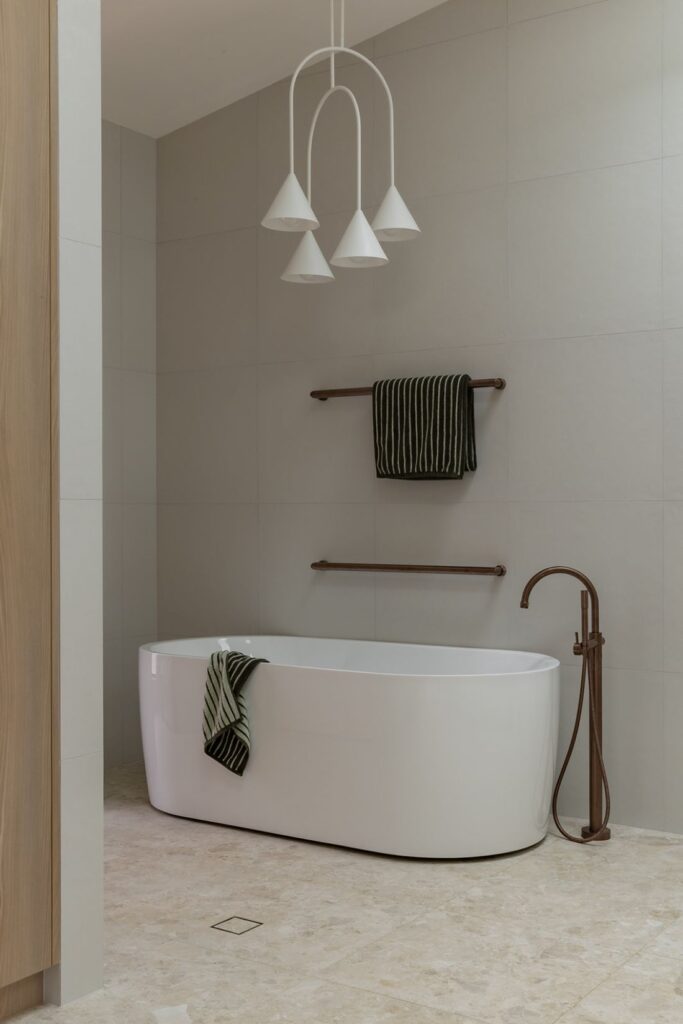 Freestanding bathtub in modern Boronia House bathroom