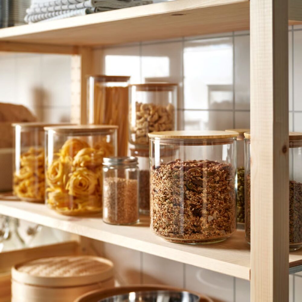 IKEA Eklatant glass pantry jars on timber shelving