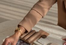 Seven decisions to make before you ask a builder to quote your renovation Material samples including stone, timber, tile and fabric arranged on a table during renovation planning.