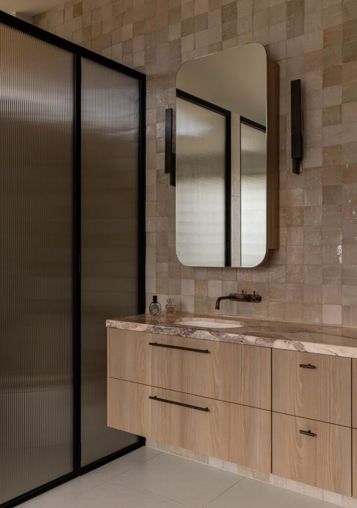 Master ensuite vanity with pink marble and zellige tiles