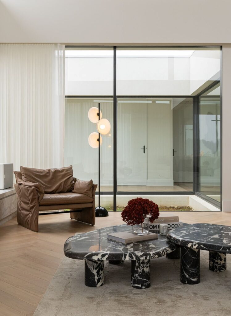 Natural stone table and courtyard glass wall view