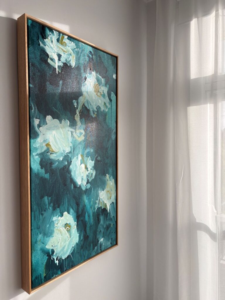Vertical blue floral canvas bathed in natural sunlight