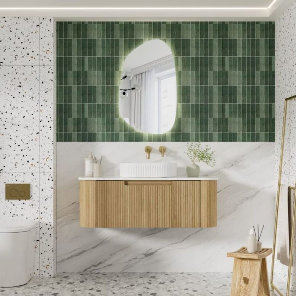 Timber fluted floating vanity in green tiled bathroom