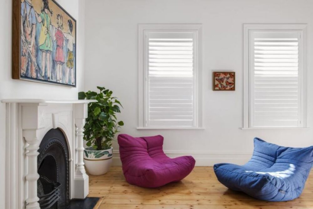 White Plantation Shutters in Minimalist Living Room
