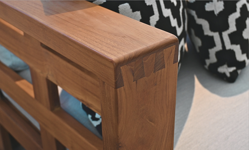 Close-up of dovetail joinery on teak outdoor sofa