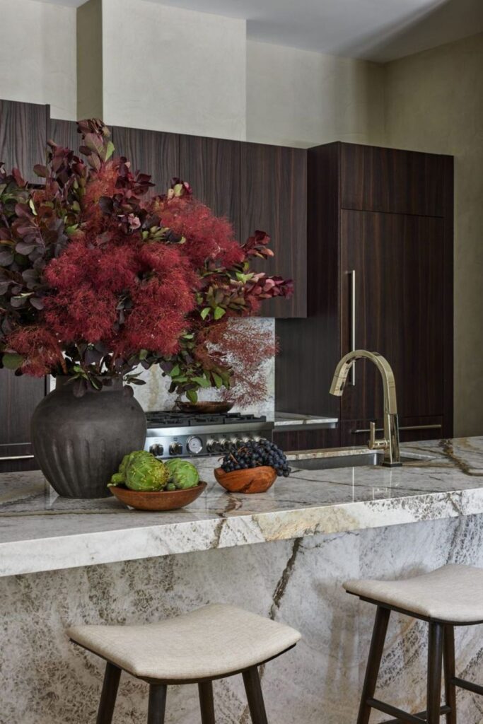 Dark smoke bush arrangement on marble kitchen island