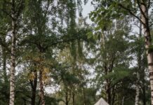 How to create a chic camping escape: Easy glamping ideas to elevate your campsite Luxury glamping tent setup with outdoor fire pit
