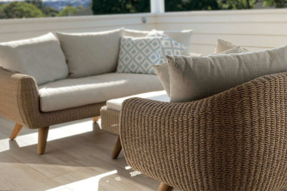 Outdoor woven wicker lounge setting on verandah