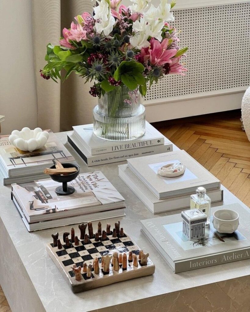 Reeds and lilies arrangement on styled coffee table