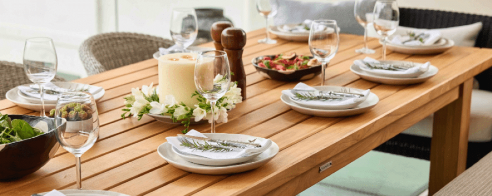 Slatted teak outdoor dining table set for entertaining