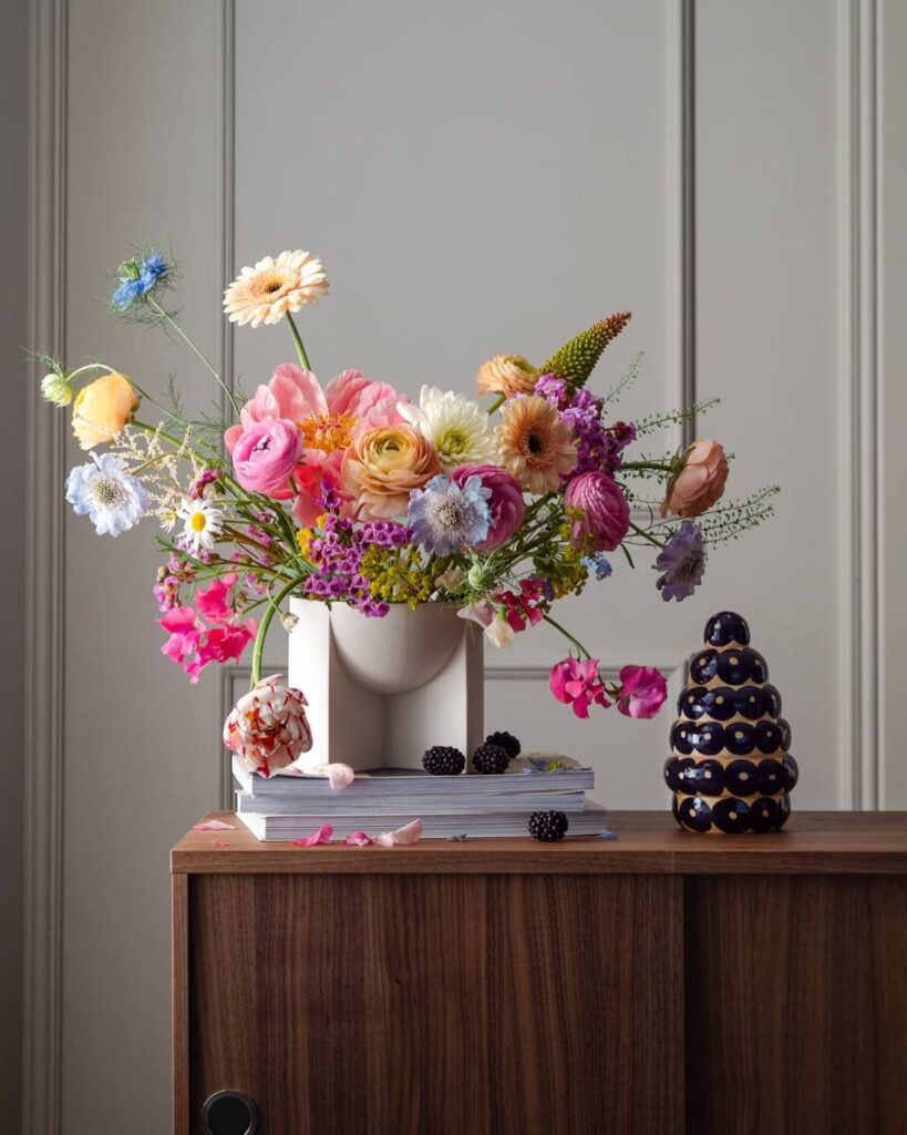 Wild pastel bouquet on wooden sideboard