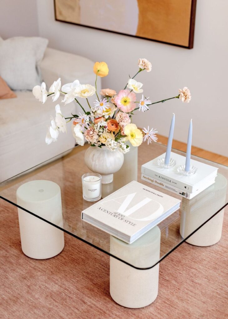 Wild pastel floral arrangement on glass coffee table